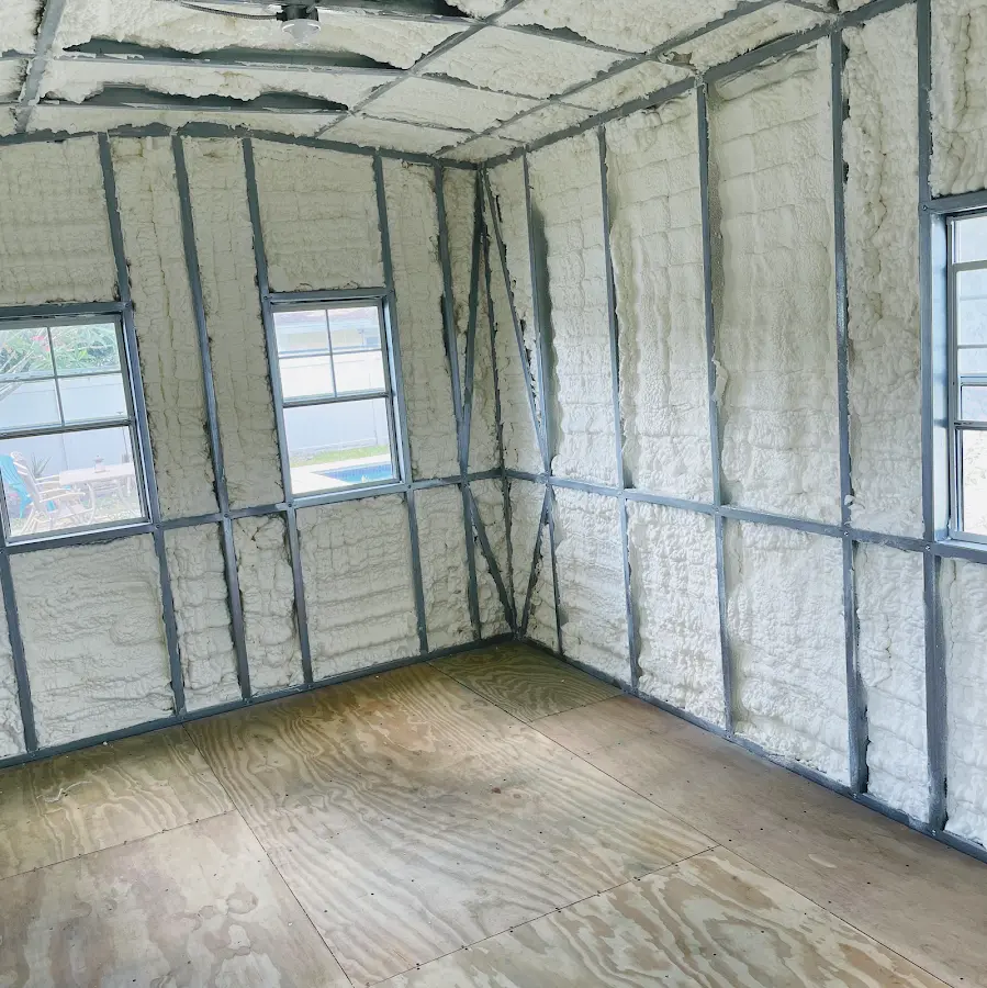 Closed-cell spray foam insulation applied to wall cavities in a residential project in Elsa
